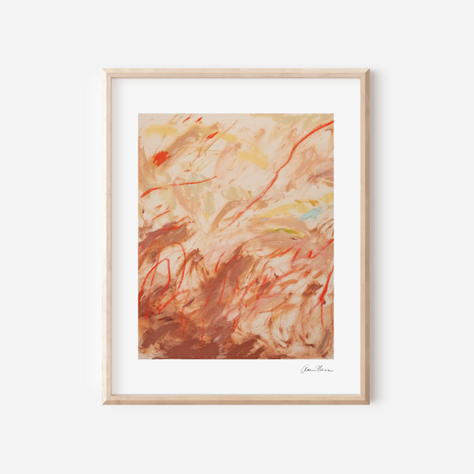 unframed abstract art print with warm colors on a white wall